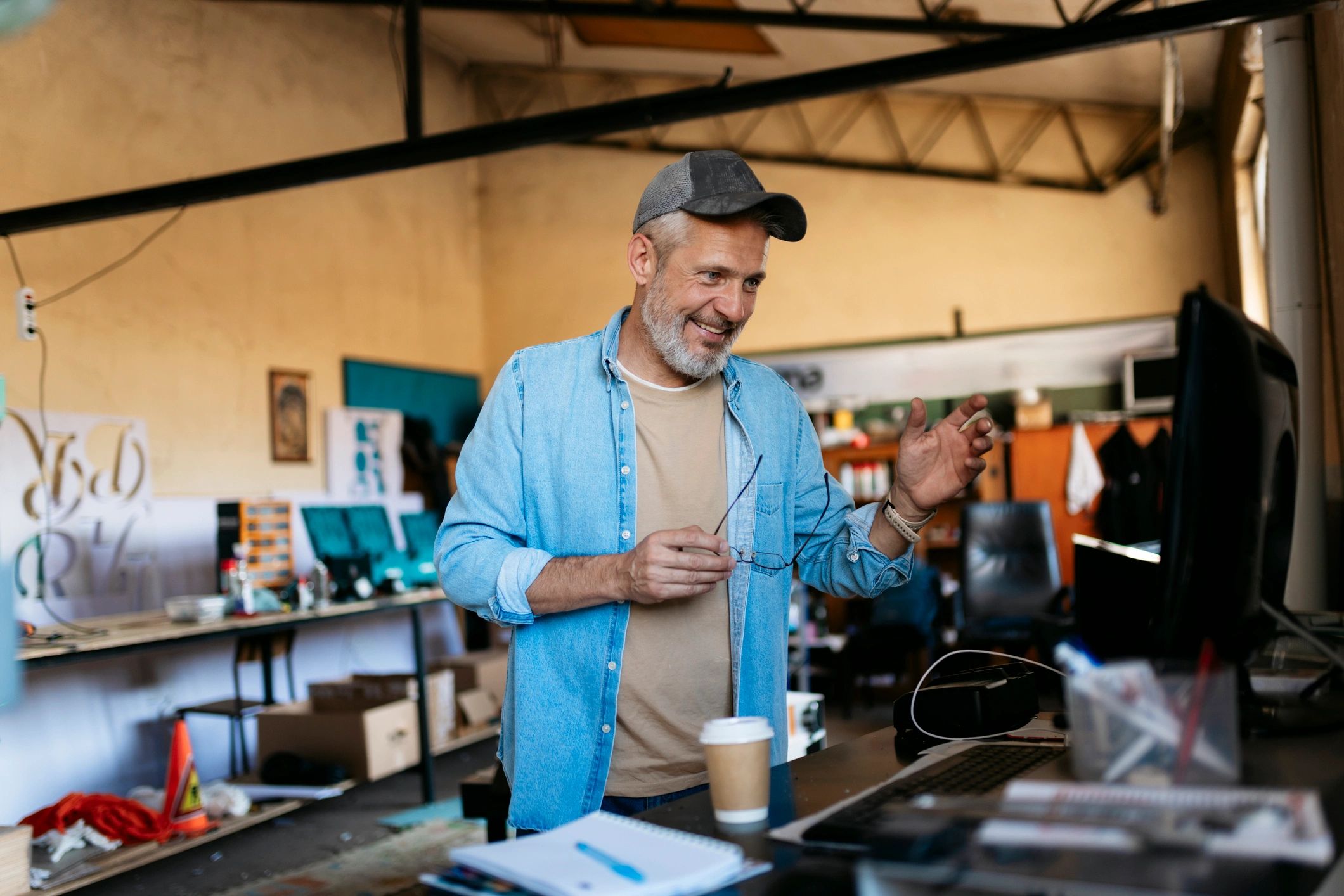Small business owner in a workshop on a video call